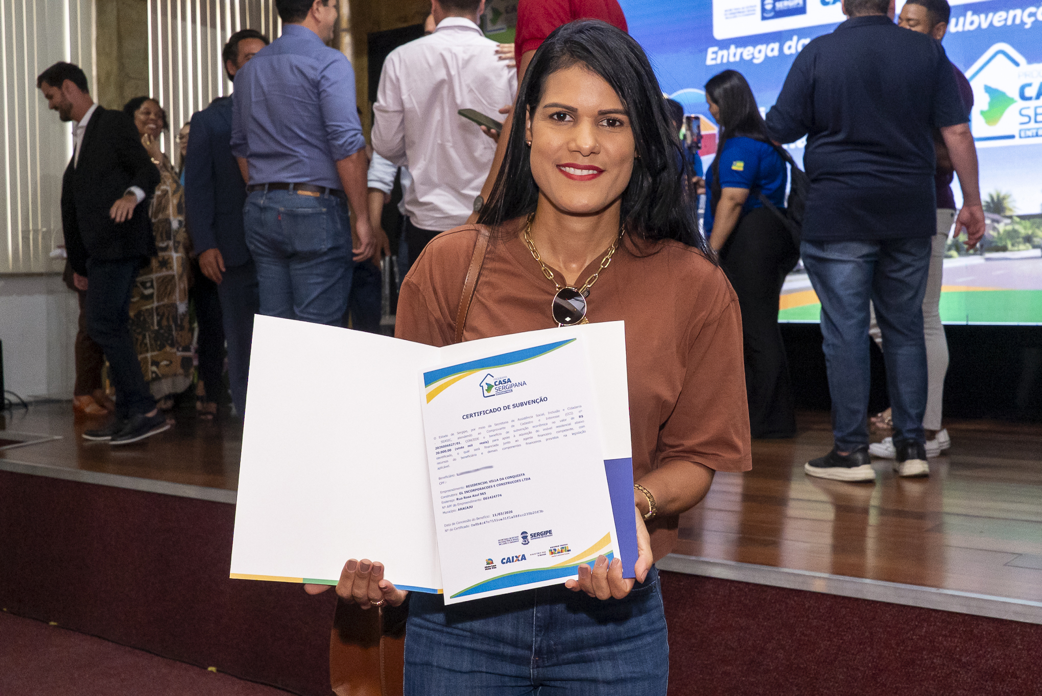 Layara Lima Torres, de 37 anos, disse que assinou contrato de compra de uma casa de dois quartos num condomínio do bairro Santa Maria | Foto: Erick O'Hara
